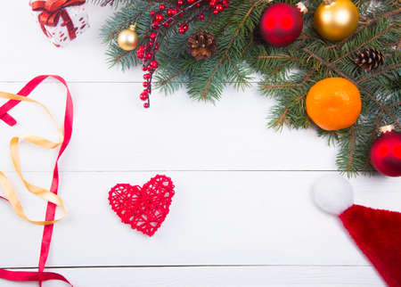 Red wicker heart on Christmas decorations background.の写真素材