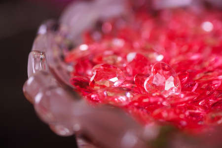 Many red little glass hearts on crystal vase. Romantic card on St. Valentine's Dayの写真素材