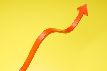 Red arrow wave graph on yellow background 3d render.の写真素材