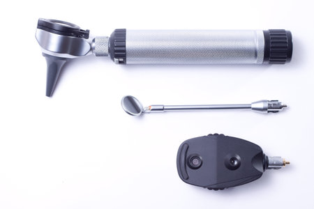 Medical diagnostic tools: rhinoscope, otoscope, pharyngoscope and ophthalmoscope isolated on white 