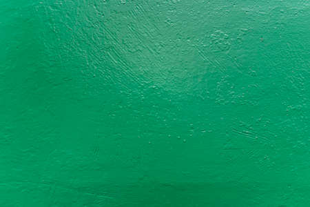 Old metal rough surfase painted in green colorの写真素材