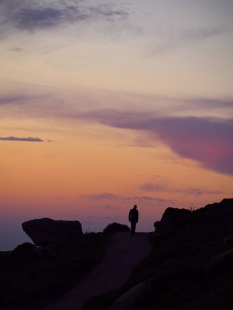 Man walking with backlightingの写真素材
