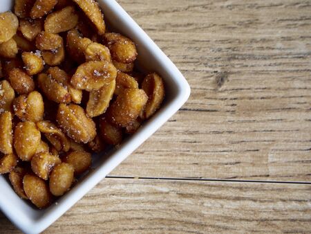 Peanuts with honey backgroundの写真素材