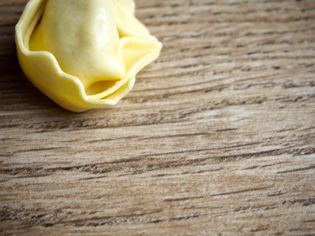 Tortellini on wood backgroundの写真素材