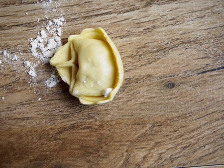 Tortellini on wood backgroundの写真素材