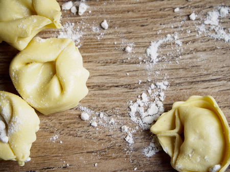 Tortellini on wood backgroundの写真素材