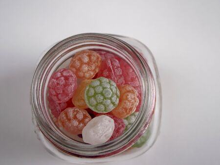 Canister of candies on white backgroundの写真素材