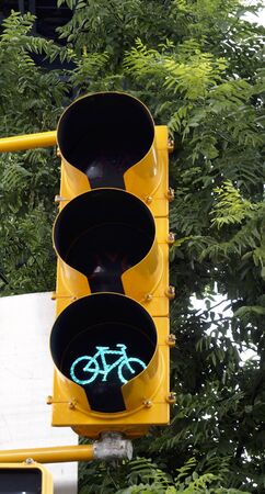 Green bicycle traffic lightの写真素材
