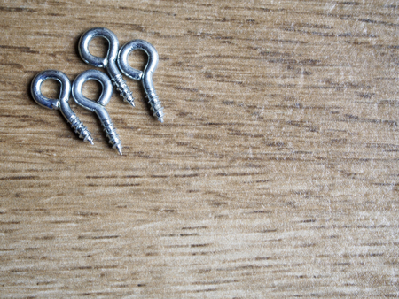 Eyebolt on wood backgroundの写真素材