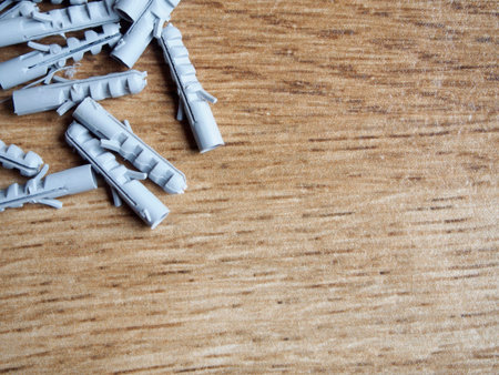 Grey nylon plugs on wood background