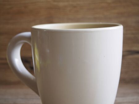 Foreground of cup on wood backgroundの写真素材