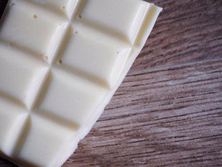 White chocolate on wood backgroundの写真素材