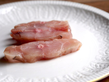 Sliced raw pompano on a plate
