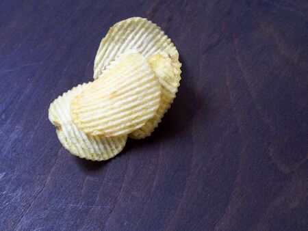 Potato chips on wood backgroundの写真素材