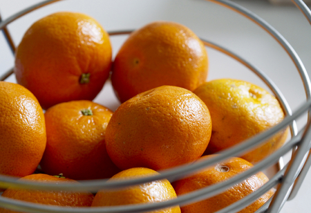 Mandarins ina a metal basket with soft-focusの写真素材