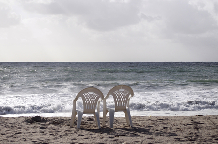 Two chairs on the beachの写真素材