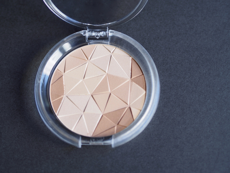 Compact powder on black backgroundの写真素材