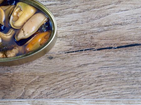 Natural mussels canned on wood backgroundの写真素材