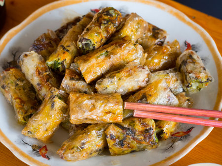 Spring roll with chopsticks in a plate