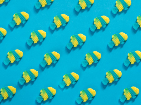 Jelly candies fish pattern on blue backgroundの写真素材