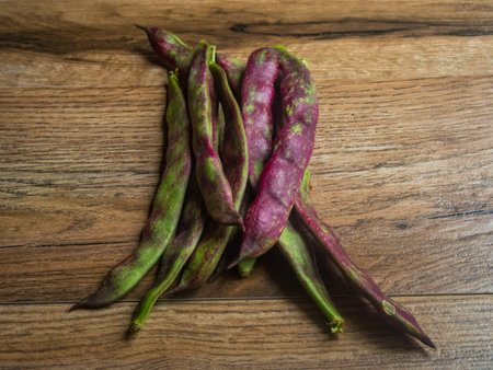 Green beans on wood background