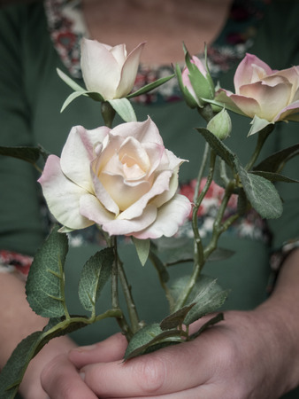 Woman holding rose flowersの写真素材