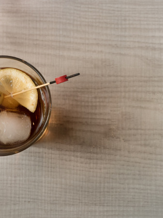 Red vermouth with olives in a glass with copy spaceの写真素材