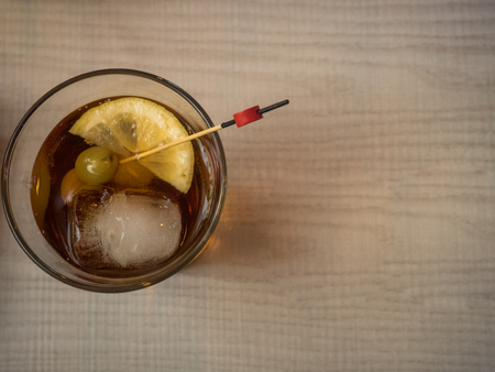Red vermouth with olives in a glass with copy spaceの写真素材