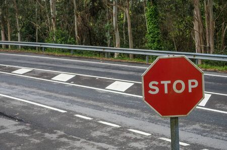 Stop sign on the roadの写真素材
