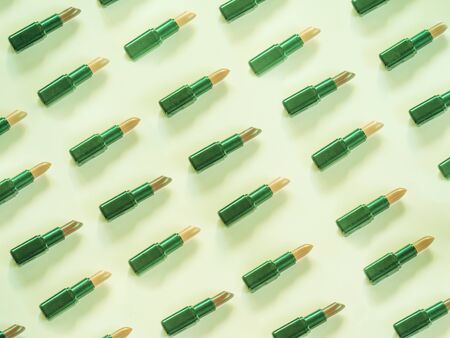 Lipstick pattern on green backgroundの写真素材