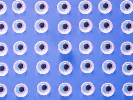 Eyes pattern on blue backgroundの写真素材