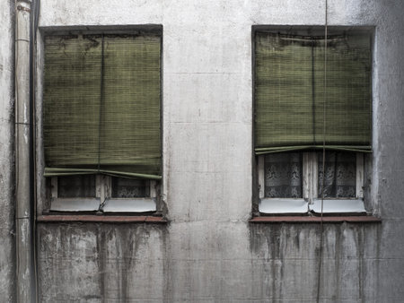 Old windows with old blinds and curtains