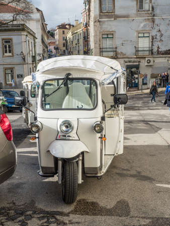 Lisbon - Portugal, January 18, 2020, Touristic tuk tuk in the street in Lisbon - Portugalのeditorial素材