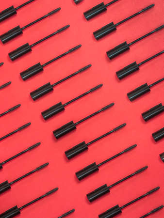 Brush rimmel pattern on red backgroundの写真素材