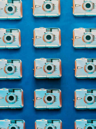 Old digital camera pattern on blue backgroundの写真素材