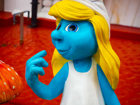 A Coruna, Spain - August 27, 2020 - Foreground of a Smurfette female Smurf figure in the Comic salon in A Corunaのeditorial素材