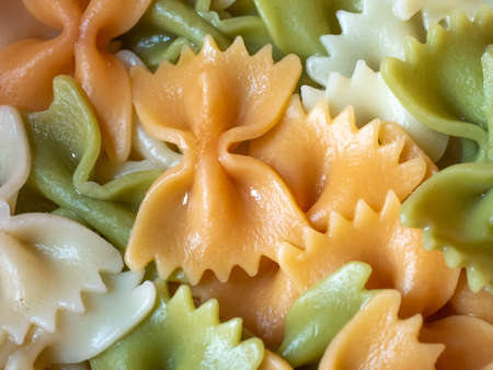 Colored cooked farfalle pasts closeupの写真素材