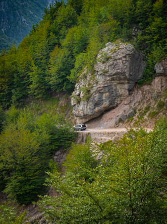 Vehicle in a dirt road difficult to driveの写真素材