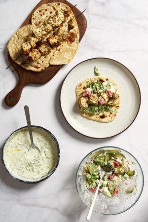 Greek chicken souvlaki pita with fresh vegetables with tzatziki sauce