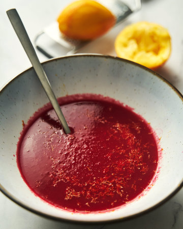 orange and beetroot soup in large bowl. Sweet and sour soup with citrus flavourの写真素材