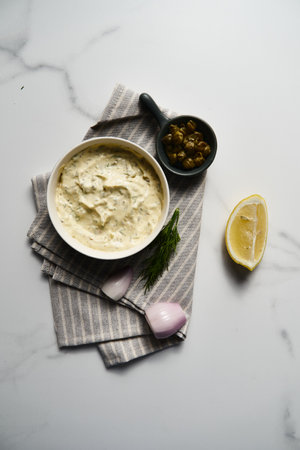 Classic Tartar Sauce dip in the bowl. Mayonnaise with dill and capers plus lemon, shallot onion. Worcester sauce and Dijon Mustard.の写真素材
