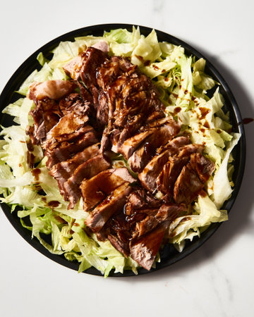 Chinese Soy Pork. Pork braised in oyster and soy sauce with sugar. Served on iceberg salad.の写真素材