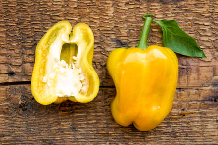 sliced bell peppers on wooden backgroundの写真素材