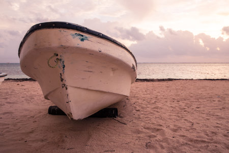 boat on sandy Tropical Caribbean beachの写真素材