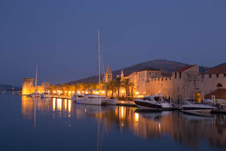 Waterfront view of beautiful Trogir, Croatia - Unesco World Heritage Site. Image taken before sunrise, at the blue hour.の写真素材