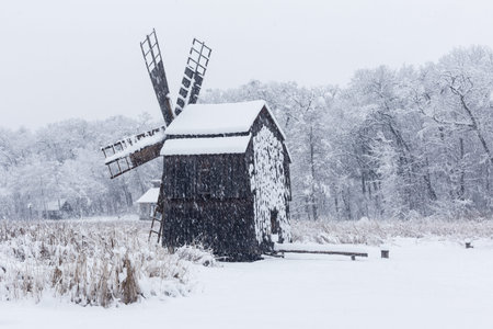Windmill in Village Museum during snowy winter