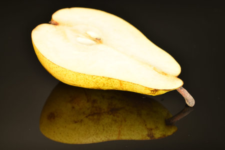Ripe juicy, organic pears, close-up, on a black background.