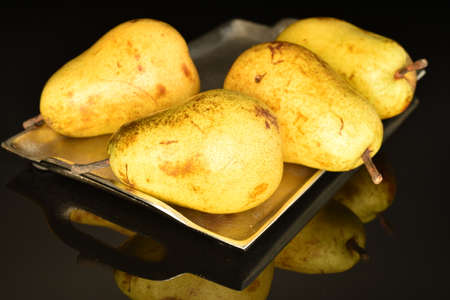 Ripe juicy, organic pears, close-up, on a black background.の写真素材