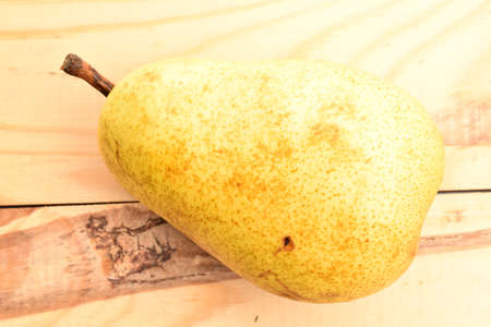 Ripe juicy, organic pears, close-up, on a wooden table.の写真素材