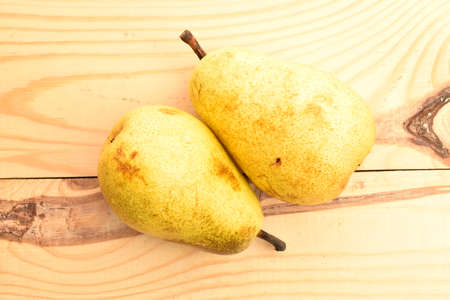 Ripe juicy, organic pears, close-up, on a wooden table.の写真素材